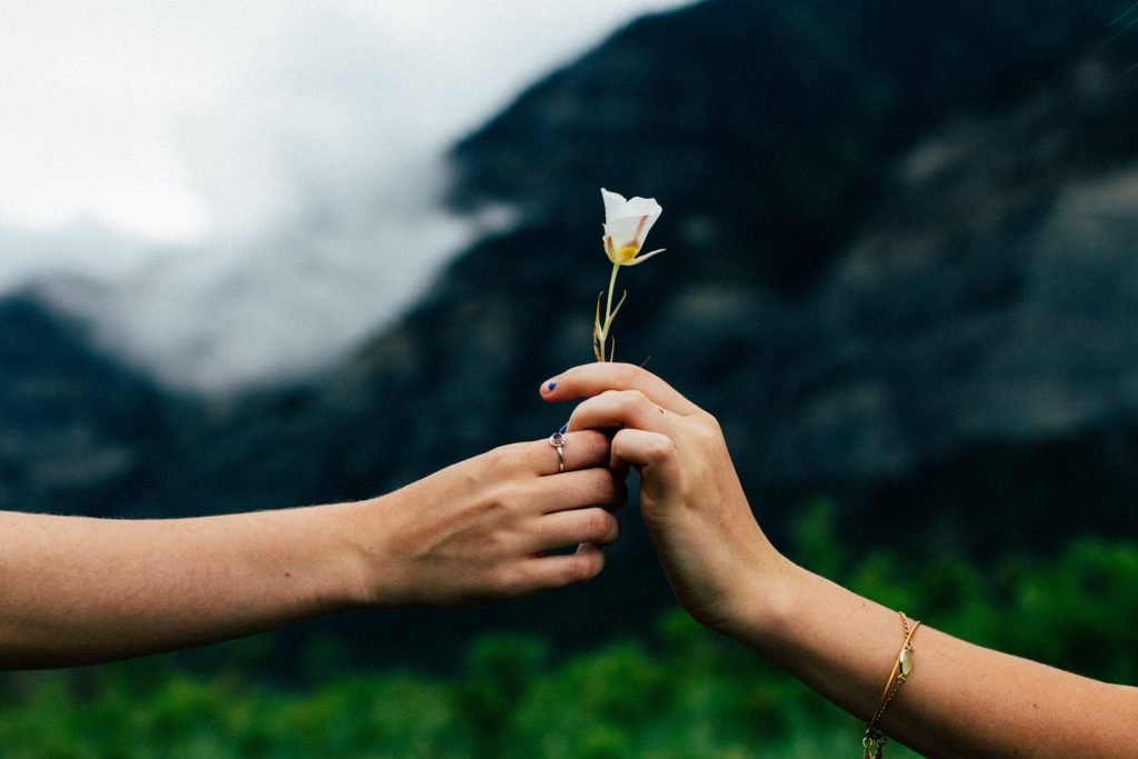 Man giving flower