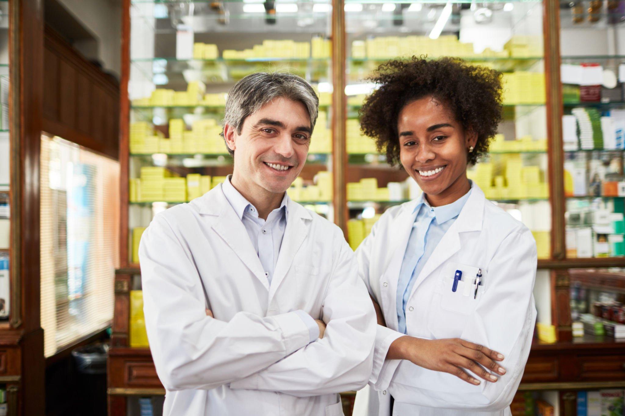 Portrait Of Two Confident Pharmacy Workers Stock Photo 